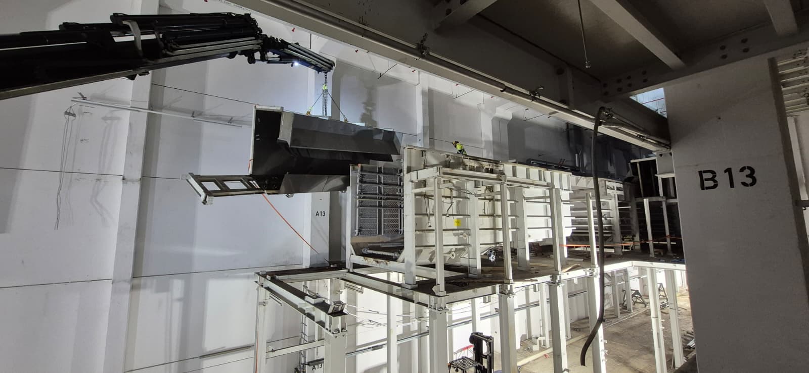 Automotive factory being dismantled by Gerritsen Group with truck mounted crane. 