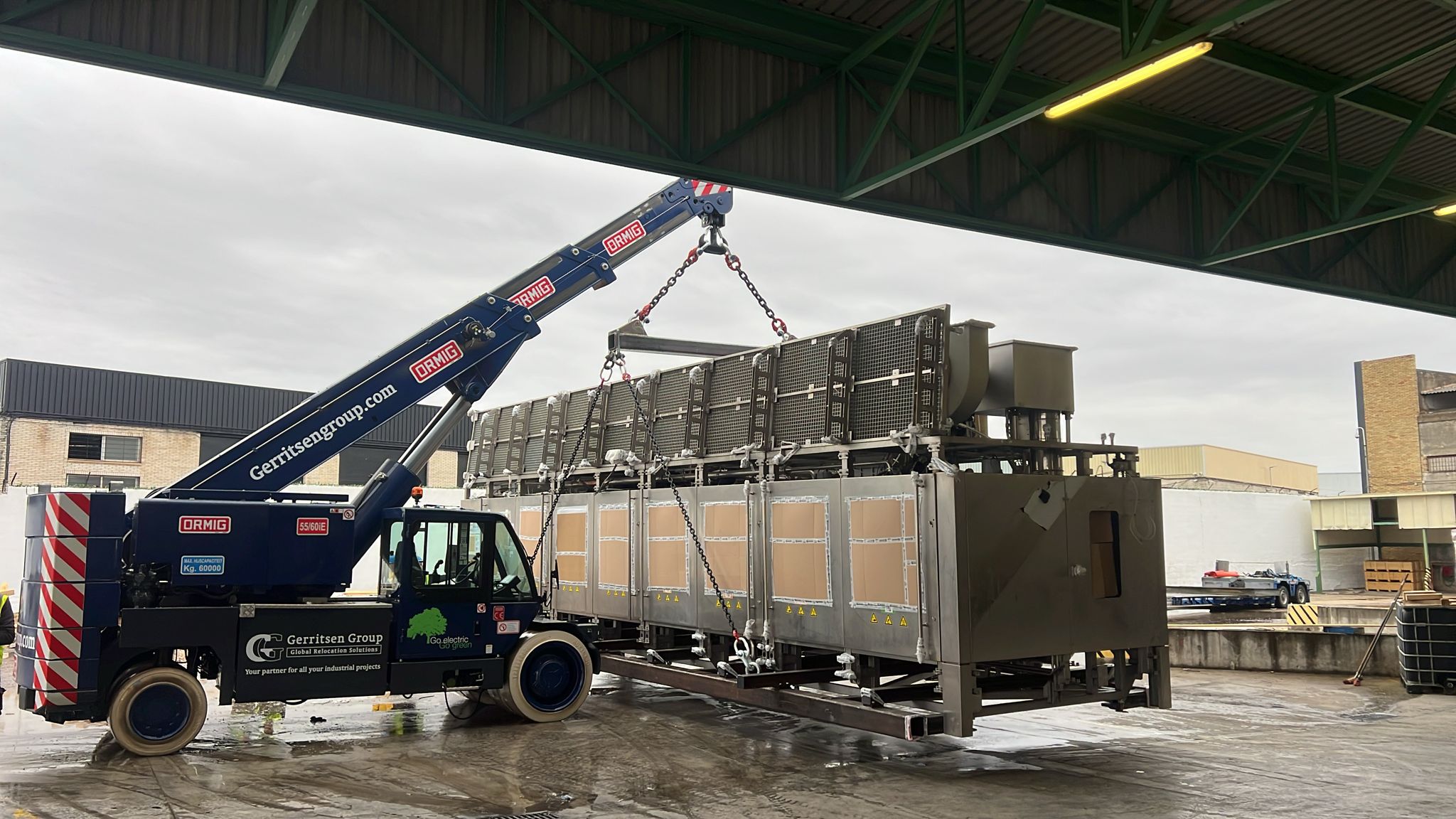 Lifting a big, oversized machine with our Ormig pick and carry crane. 